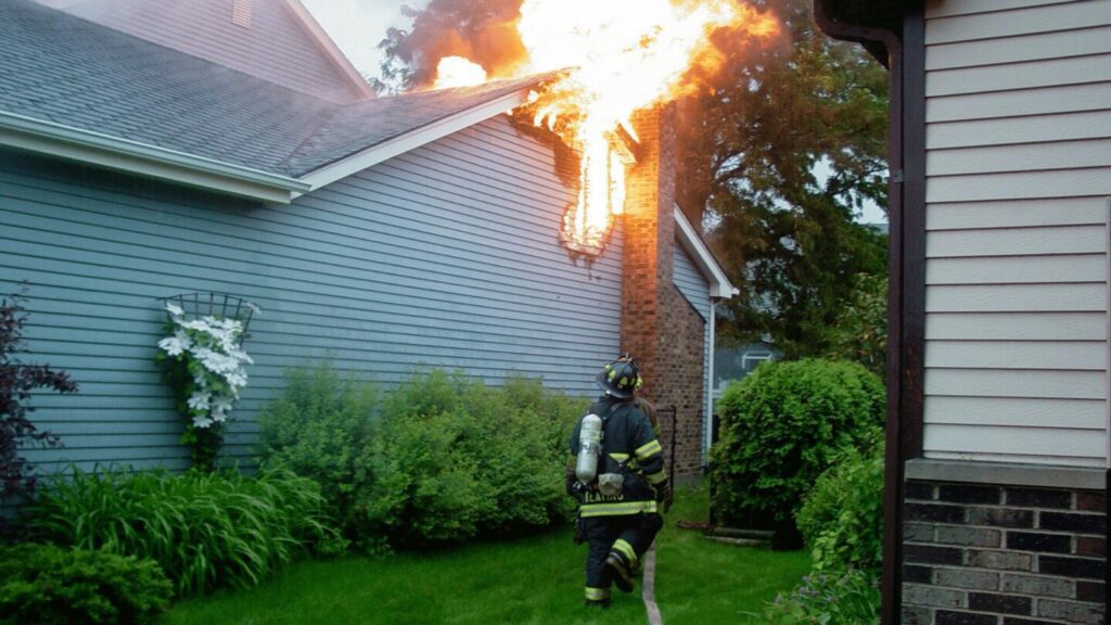 firefighters preventing fire from house neglecting Dallas chimney services