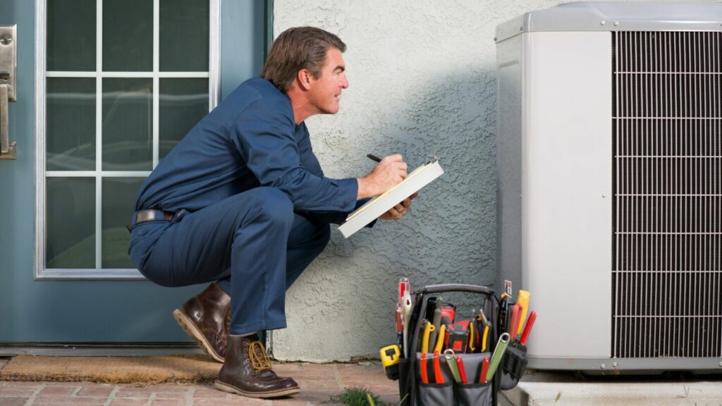 A technician fixes one of the common HVAC problems 