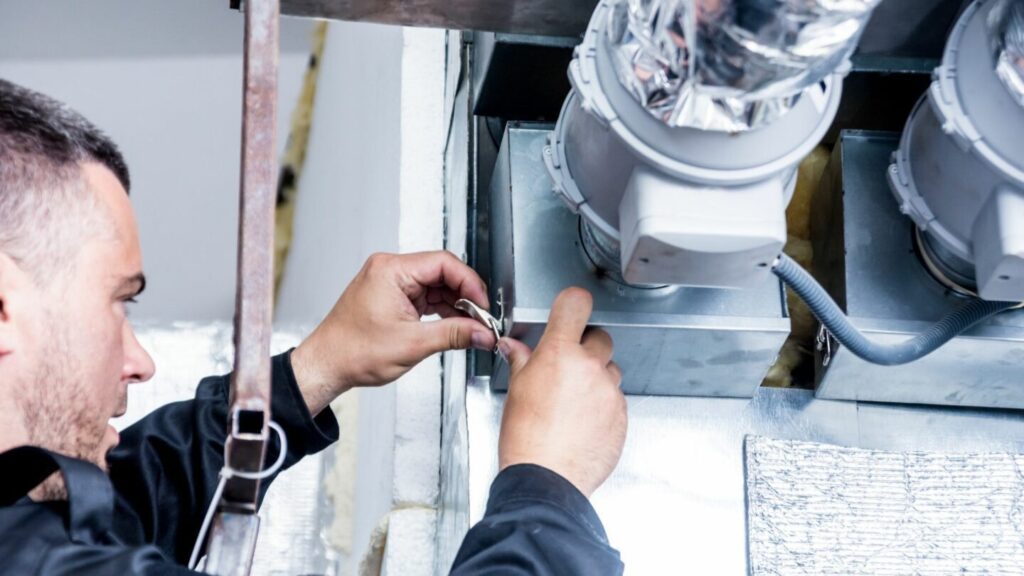 A professional works on hvac system maintenance